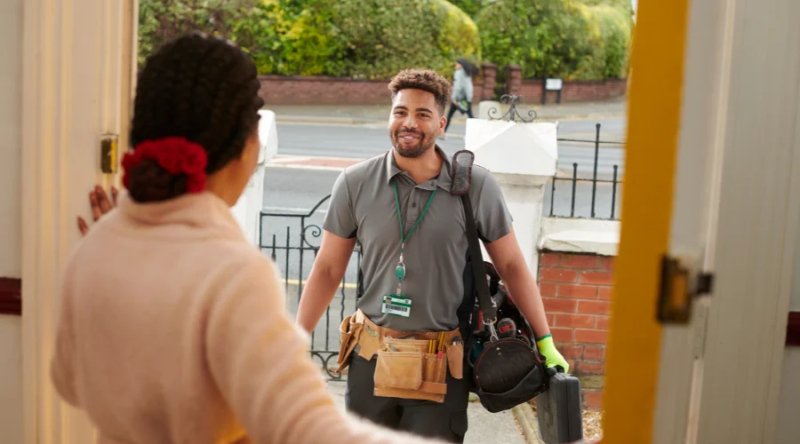 lady opening the door for a handyman